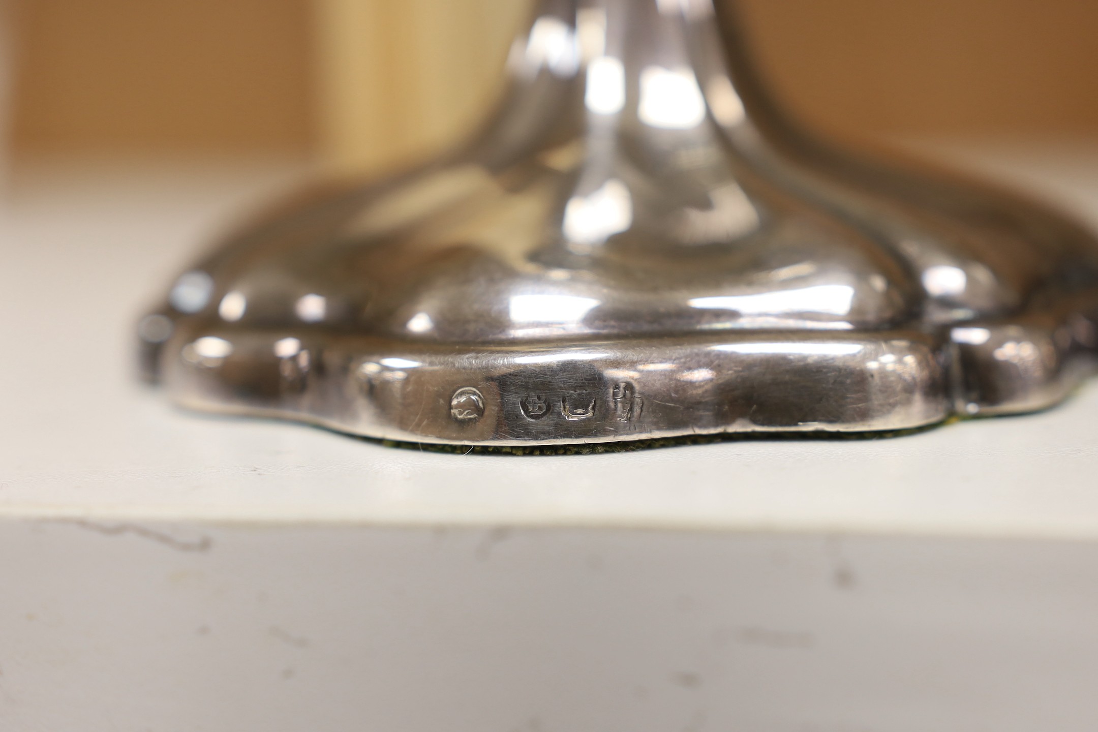 A pair of Rococo-style plated candlesticks - 24cm tall